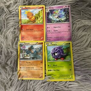 Bundle of 4 Pokémon cards.